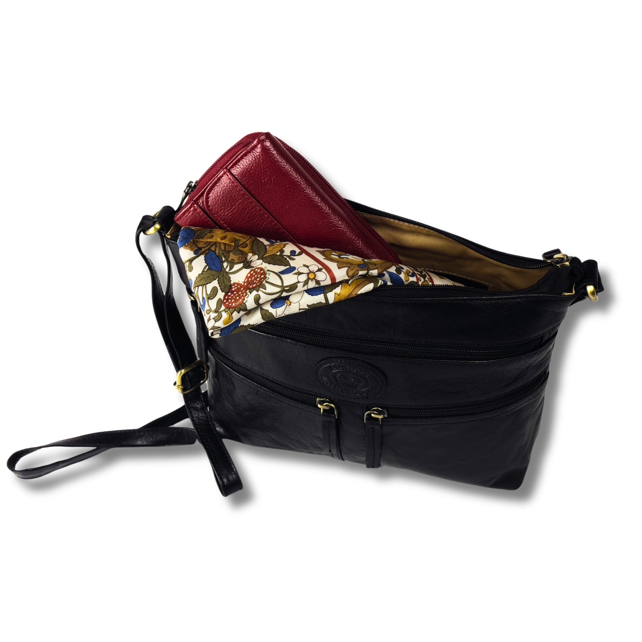 Black leather crossbody bag holding a red purse inside.