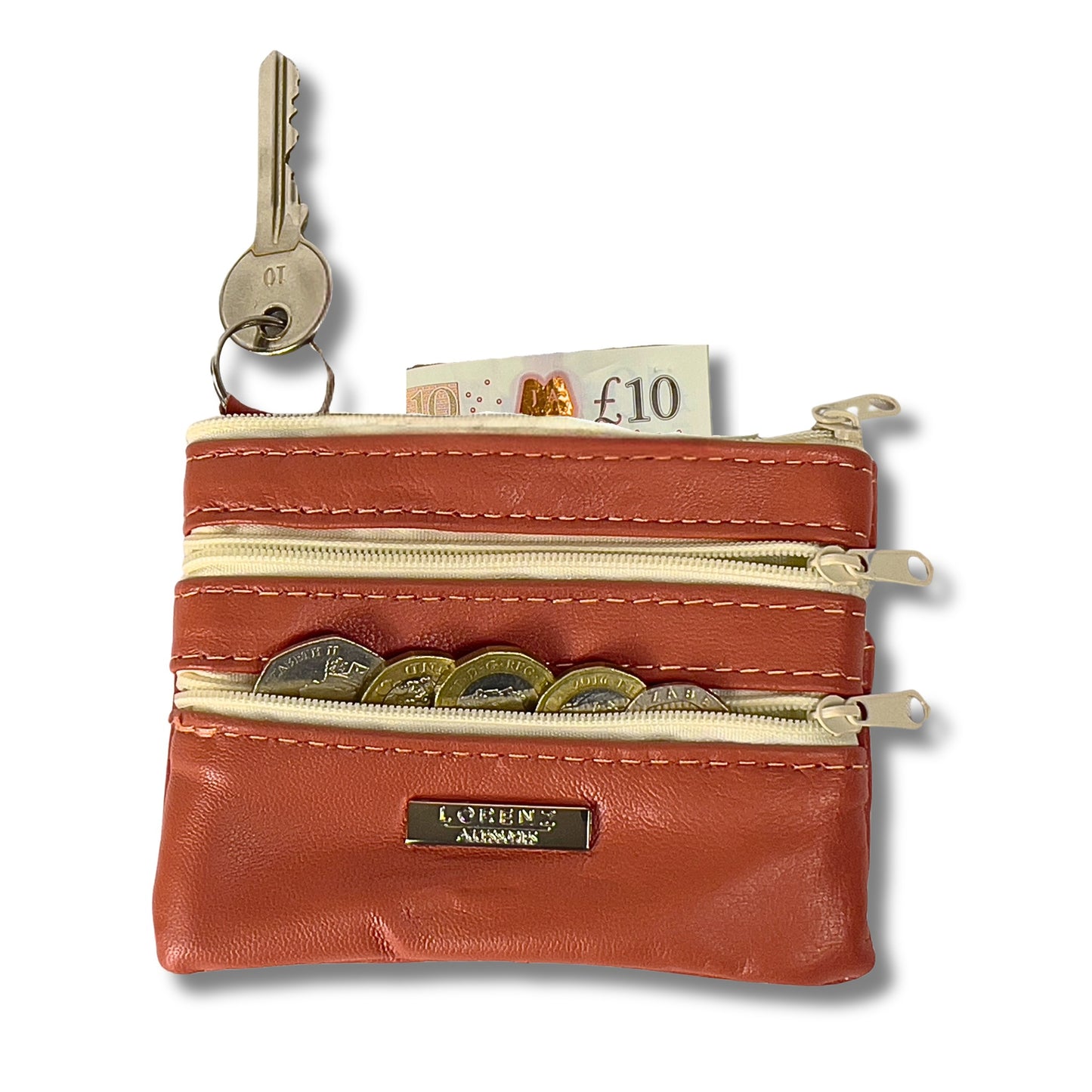 Open view of a red leather coin purse with coins, a keyring, and zippered compartments