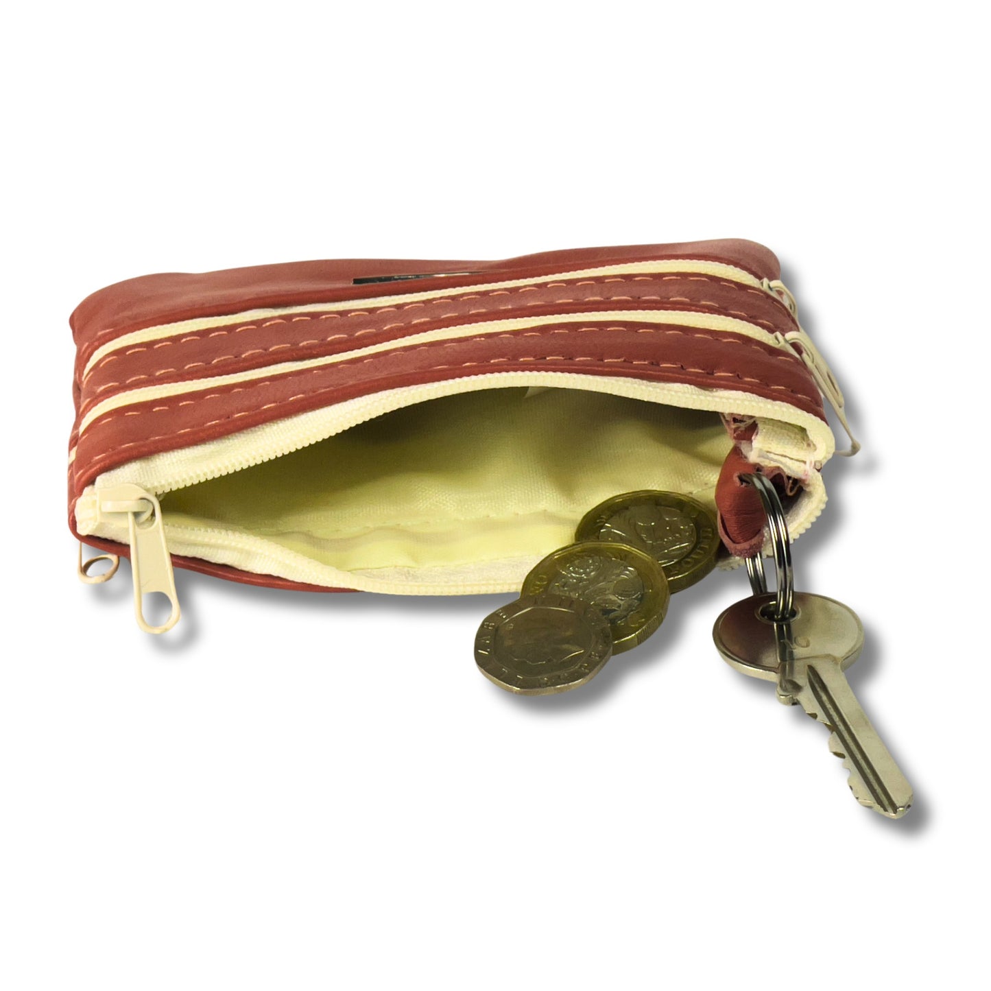 Interior of a red leather coin purse showing a keyring and space for coins and keys