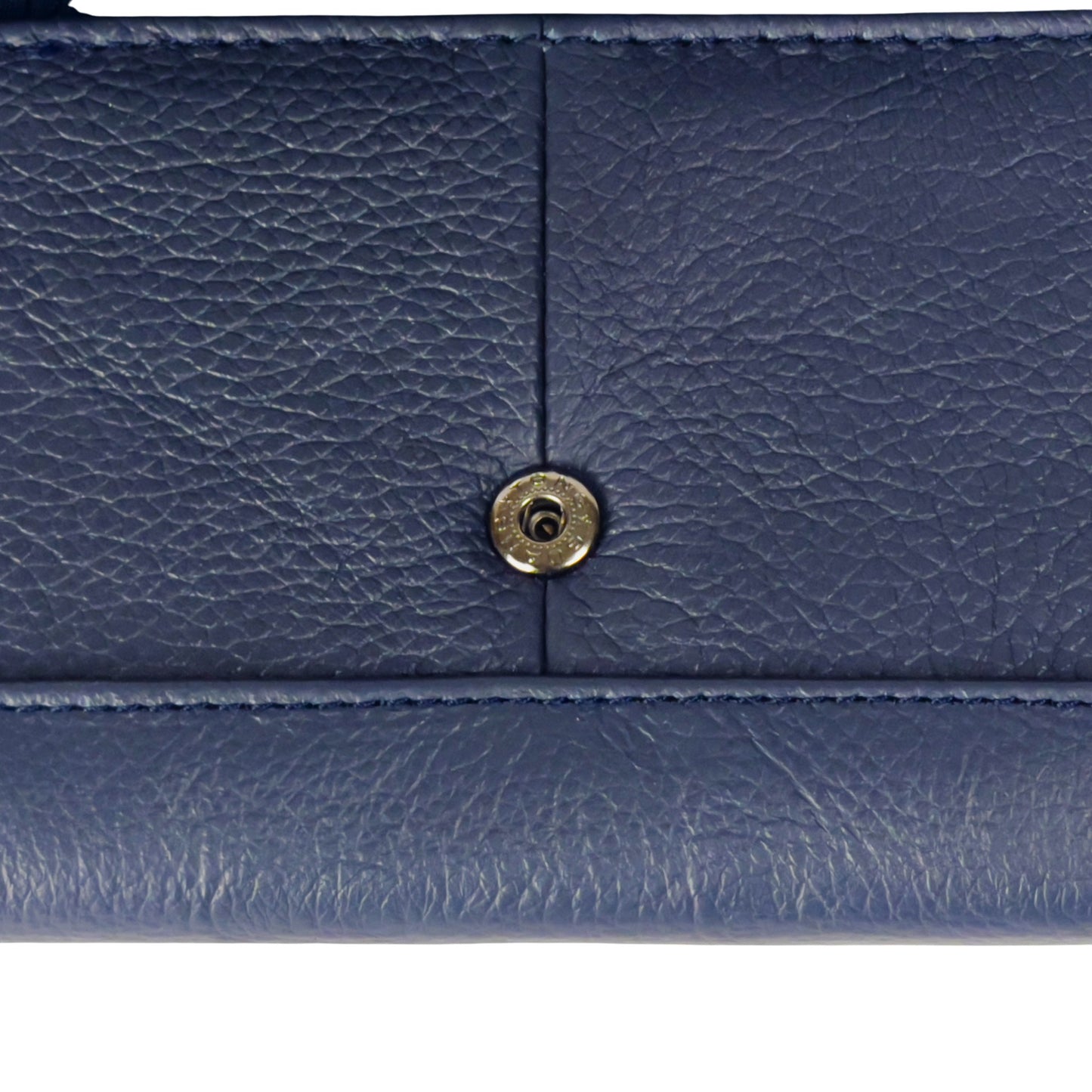 Close-up of the popper detail on a navy RFID leather wallet, emphasizing its secure fastening