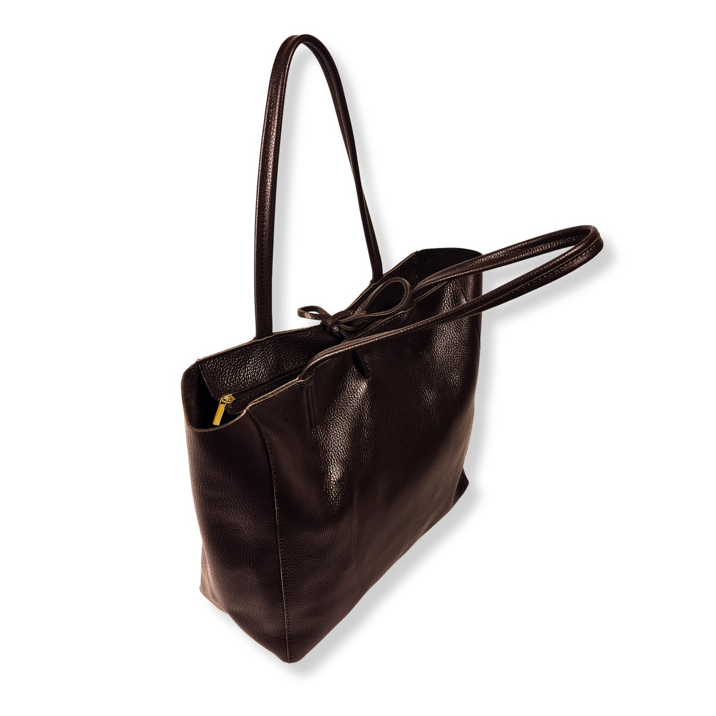 Top handle tie-up view of dark chocolate full-grain leather tote with natural folds and structure