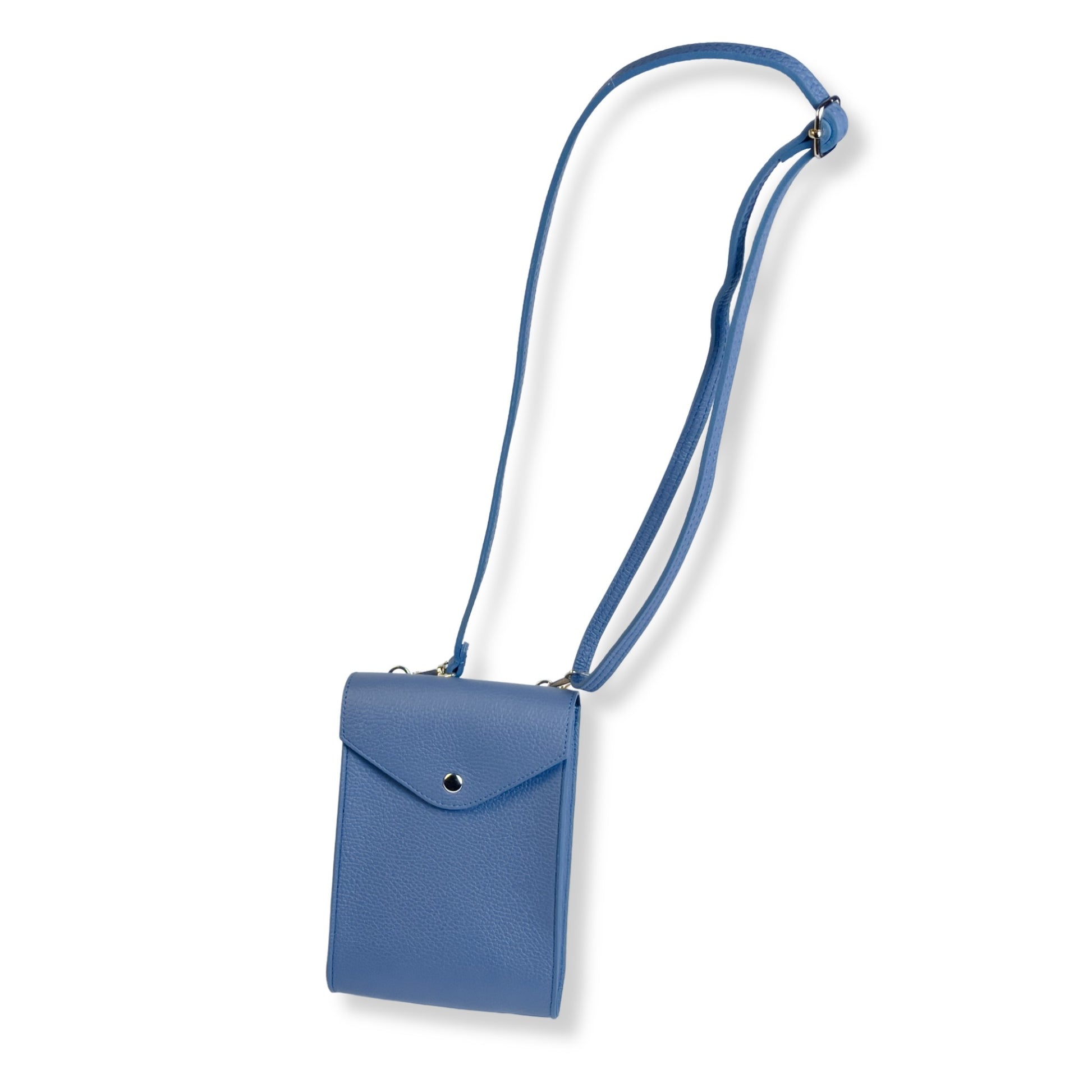 Denim blue leather crossbody bag laid flat showing full adjustable strap
