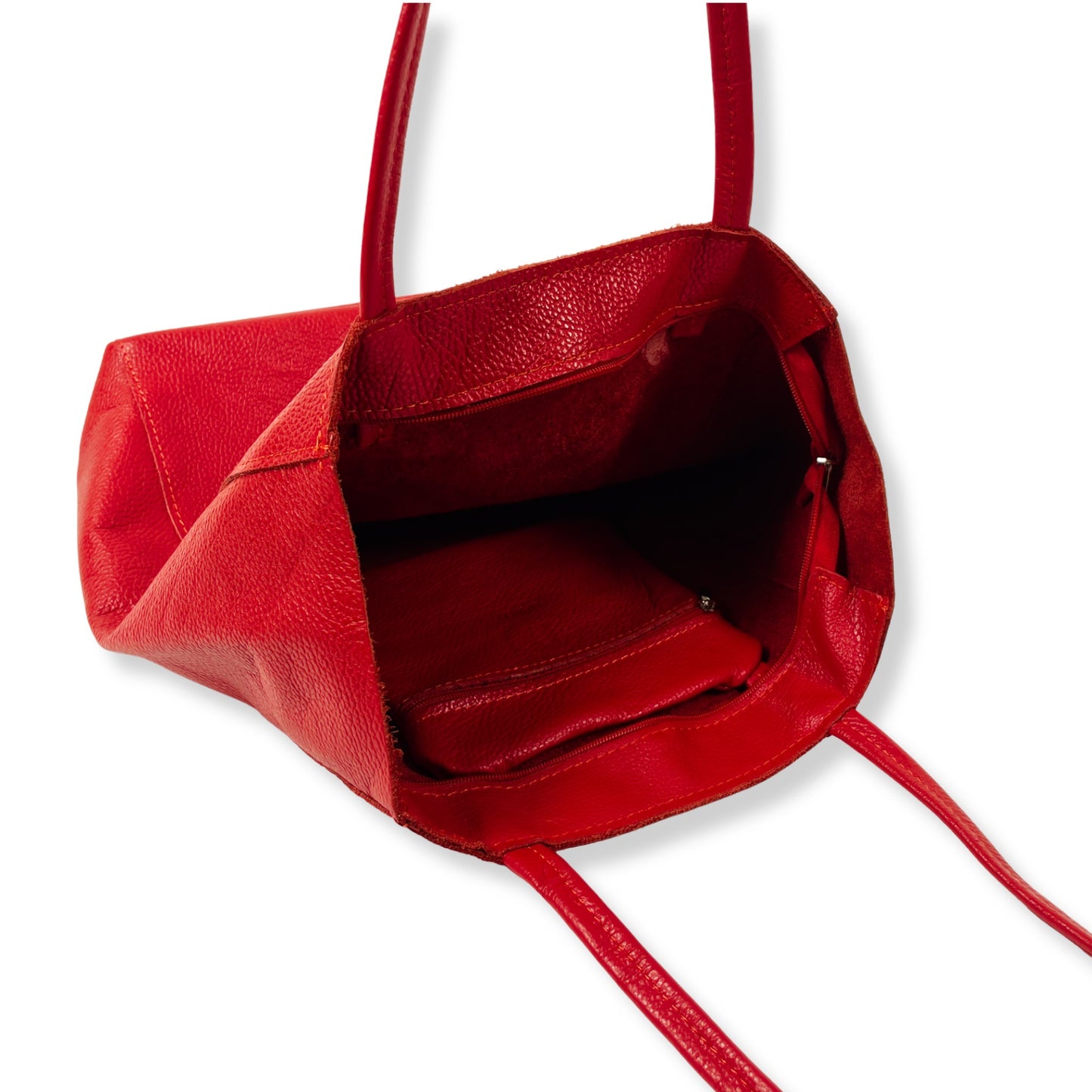 Interior view of red real Italian leather tote bag showing zip pocket and lining.
