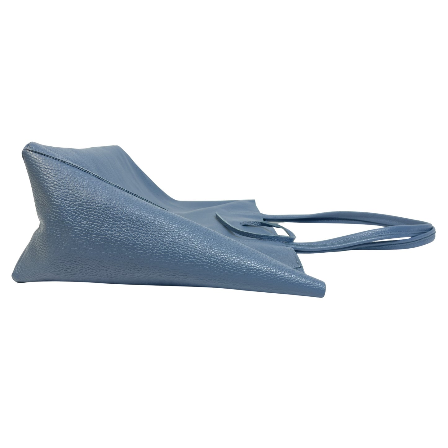 Side profile of denim blue real leather tote bag showing depth and sleek full grain finish.