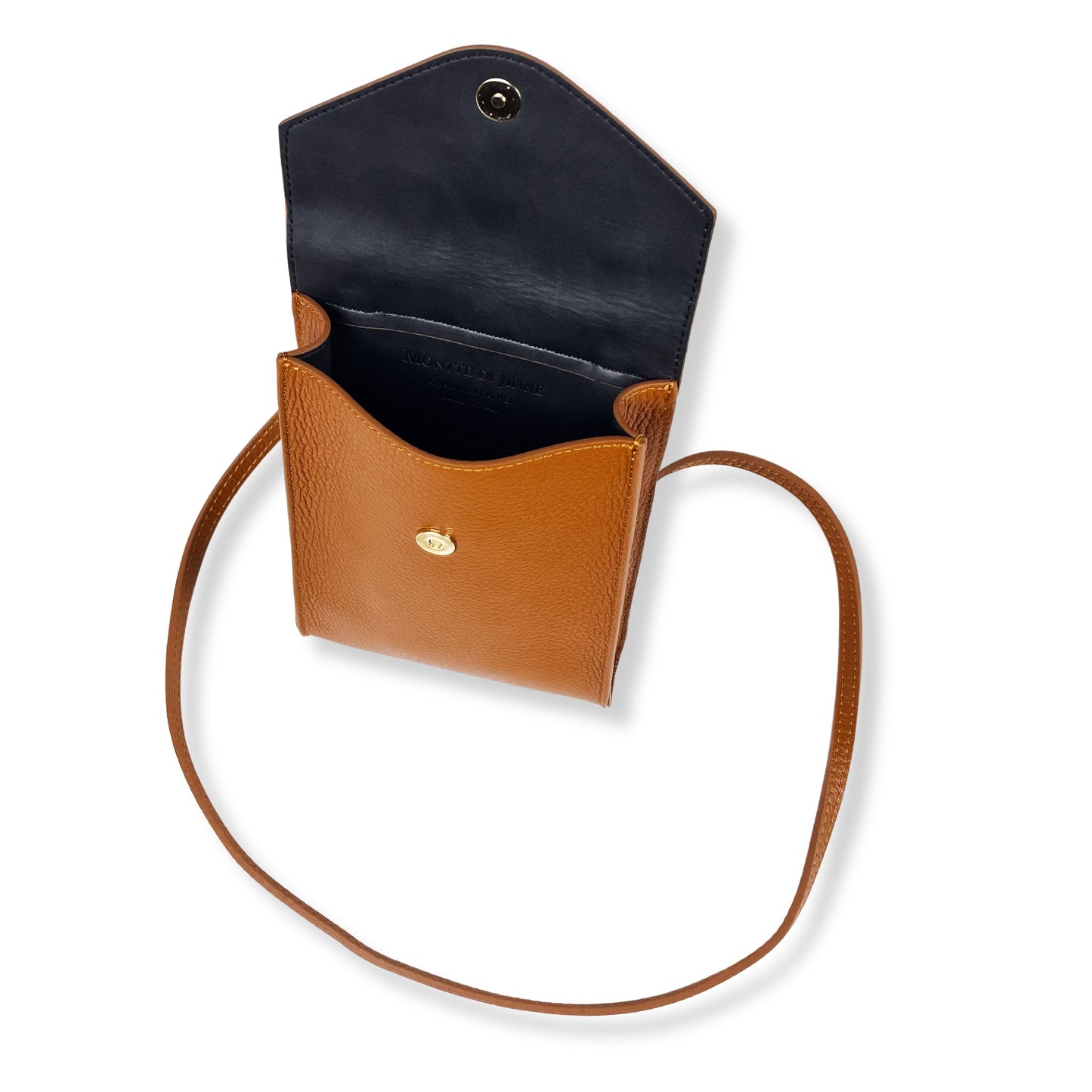 Macro close up of dark tan Italian leather grain showing craftsmanship
