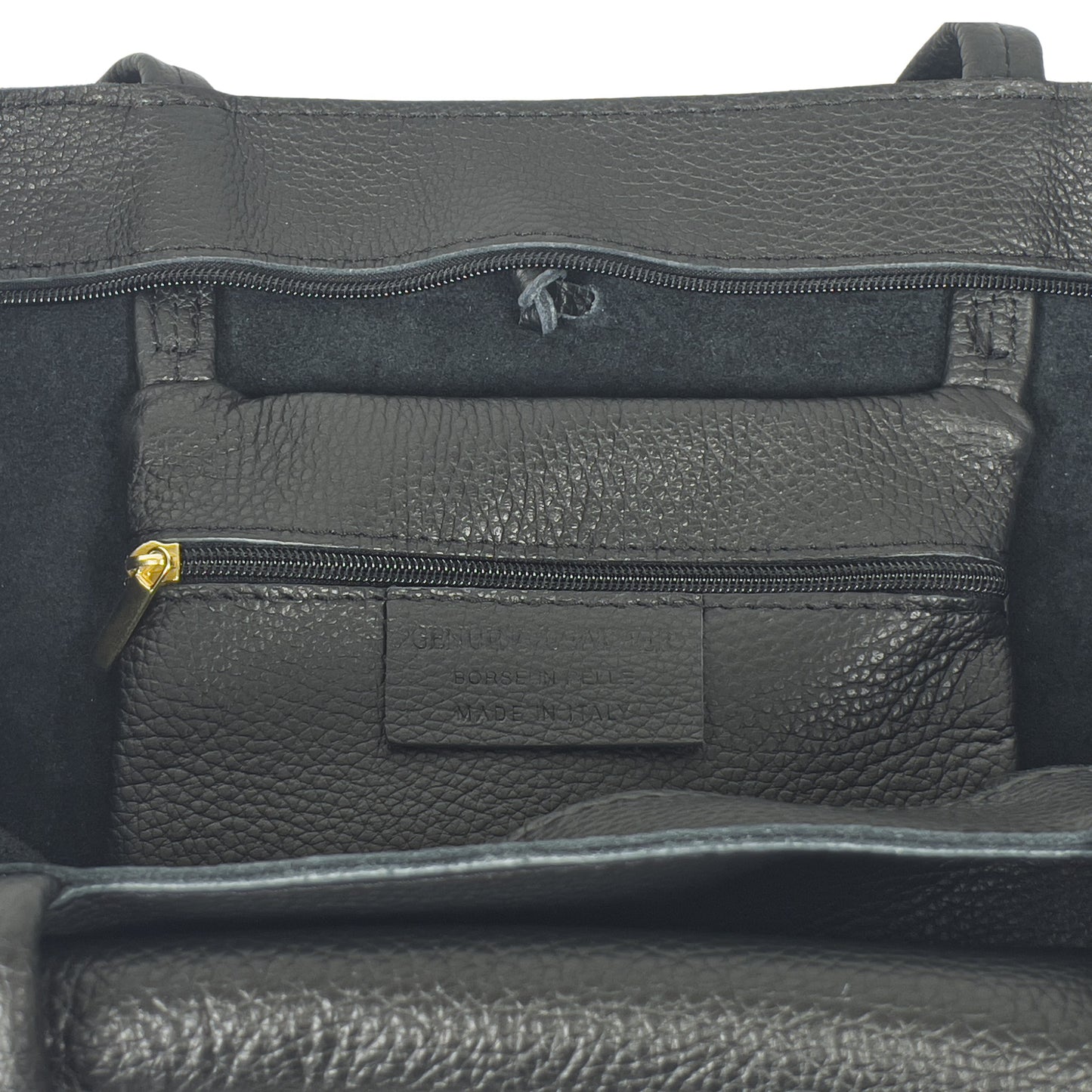 Internal pocket detail of black Italian leather tote bag with zip and soft lining