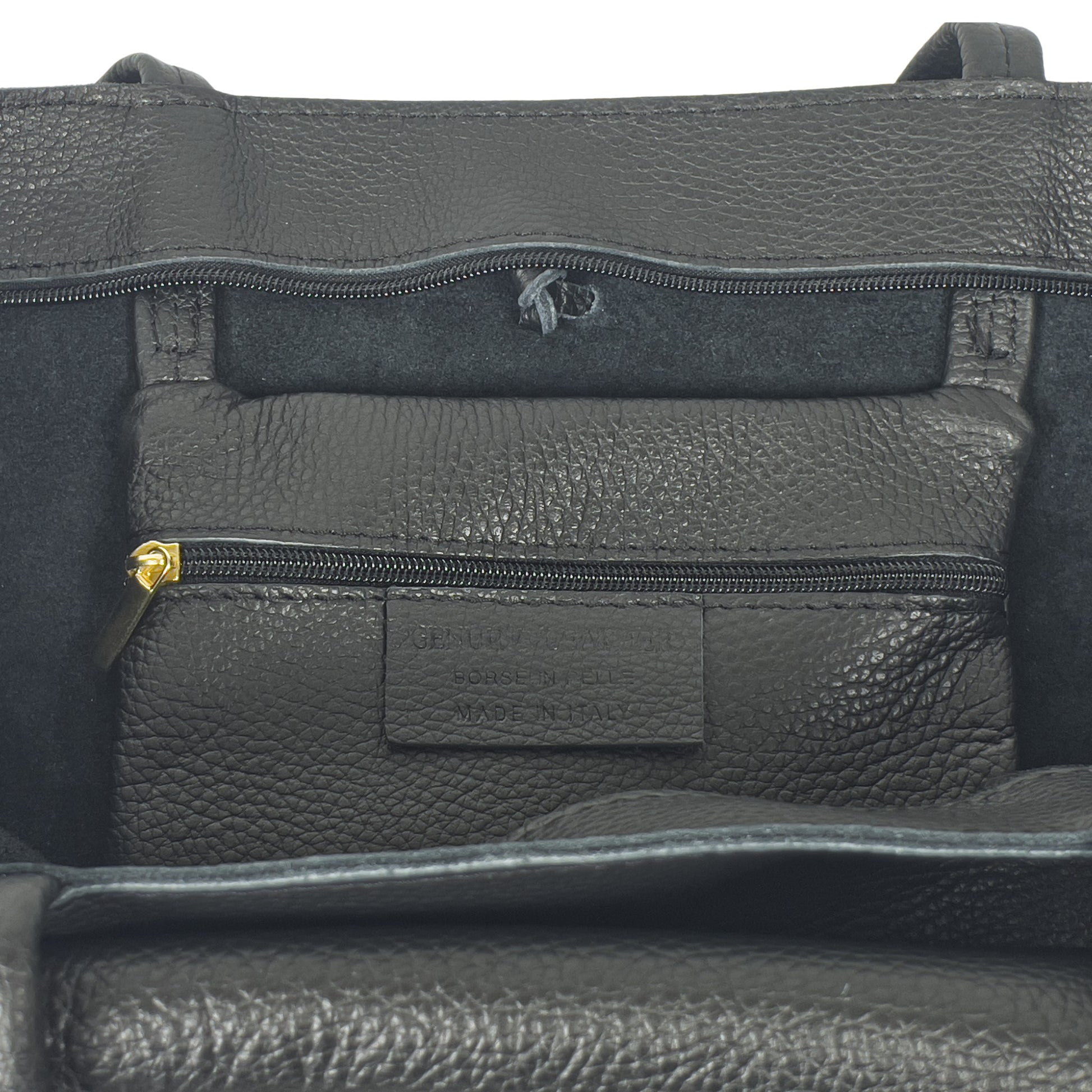 Internal pocket detail of black Italian leather tote bag with zip and soft lining
