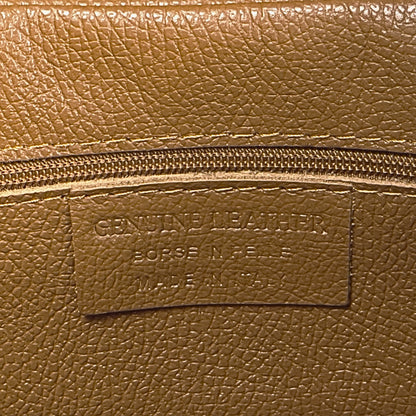 Interior stitching close-up showing functional features of the dark-tan real leather tote.