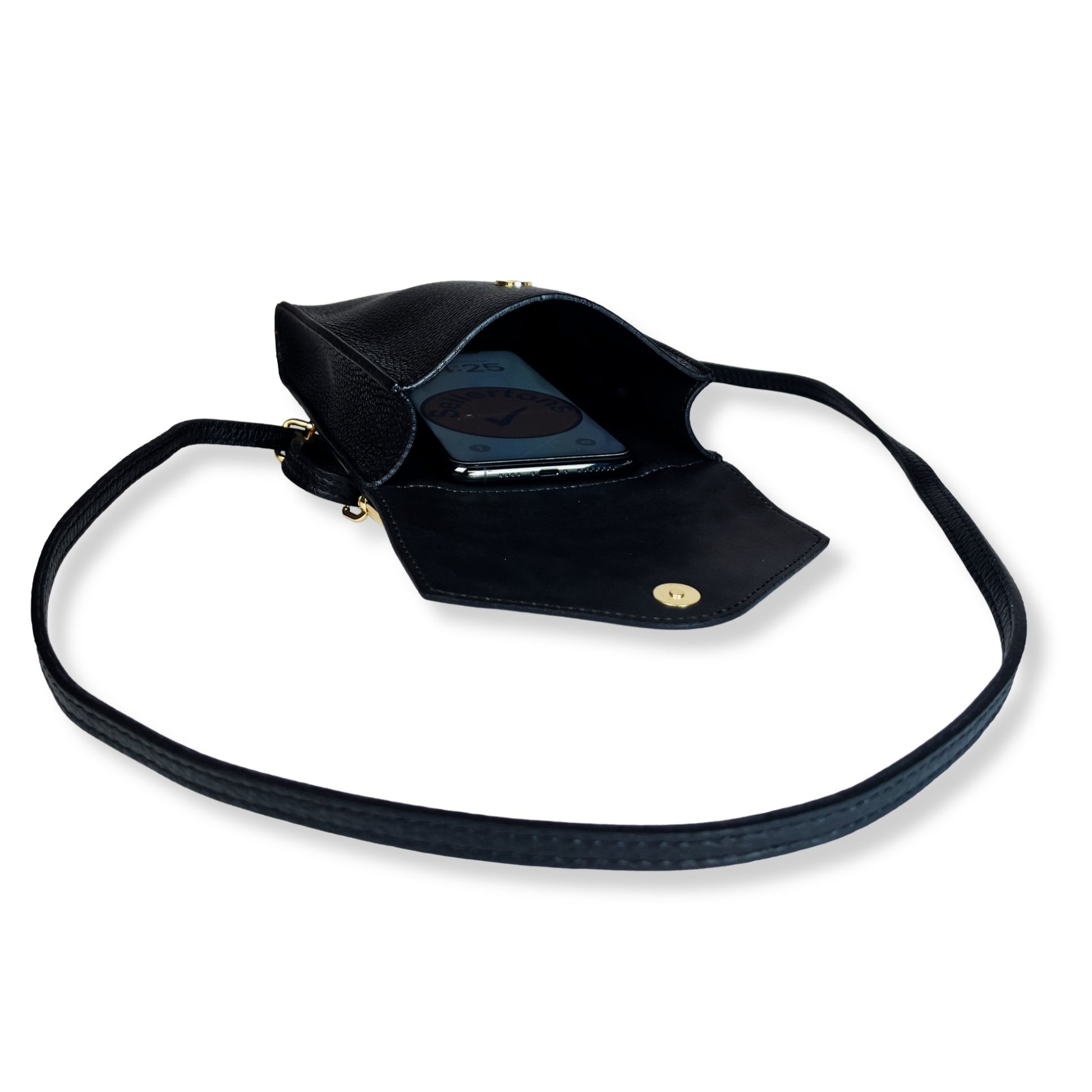 Black real leather crossbody bag flat open interior with phone visible
