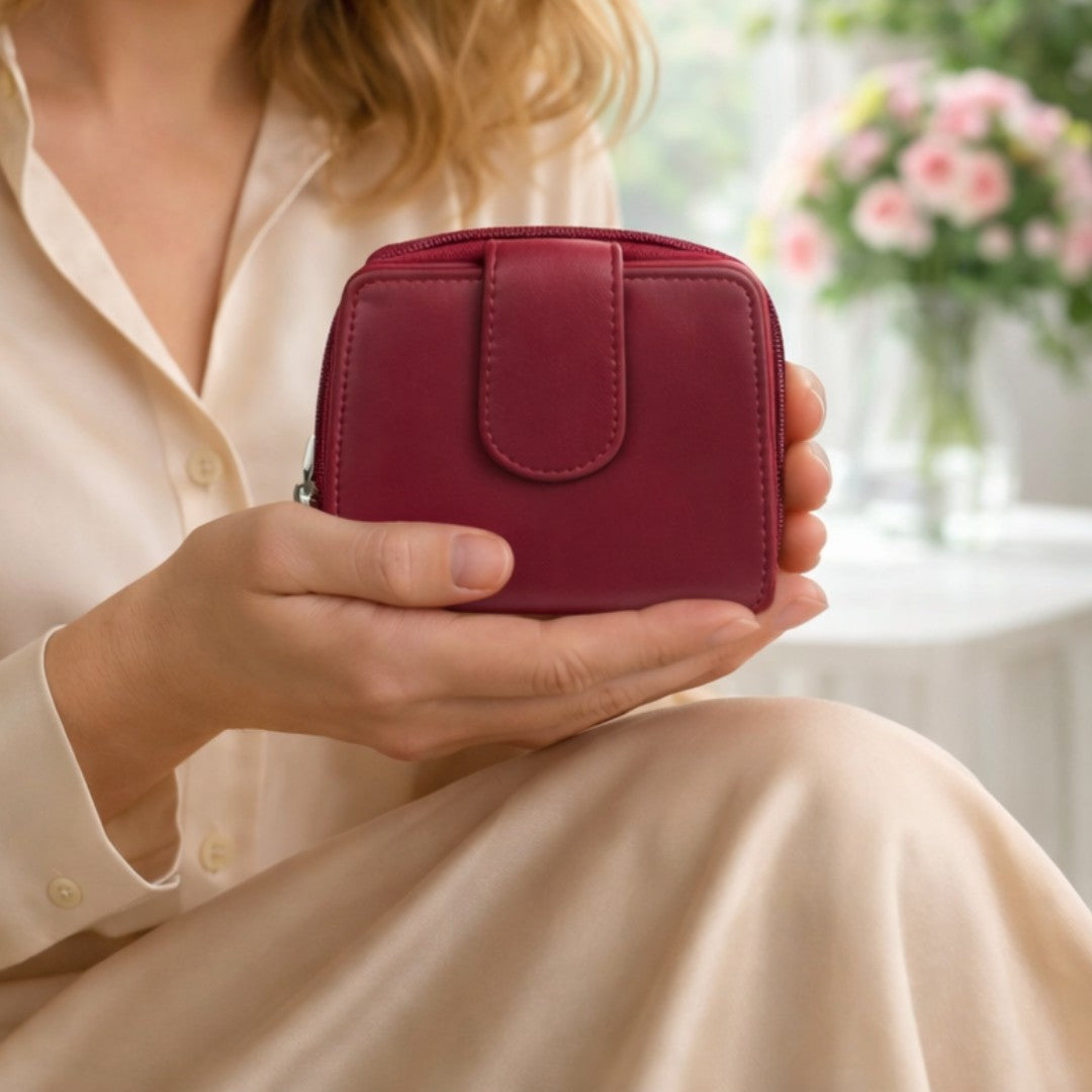 Woman holding a red soft Nappa leather RFID purse indoors, showing compact size and elegant everyday use