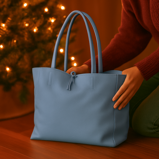 Denim blue real leather tote bag bag angled view in festive scene real leather denim blue sellertons, showing craftsmanship and detail.