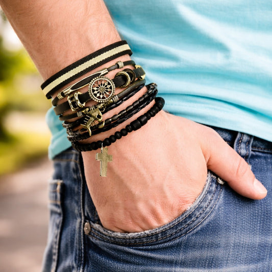 Man wearing a multilayer leather bracelet set with dream catcher charm and black beads, shown on wrist in a casual lifestyle setting