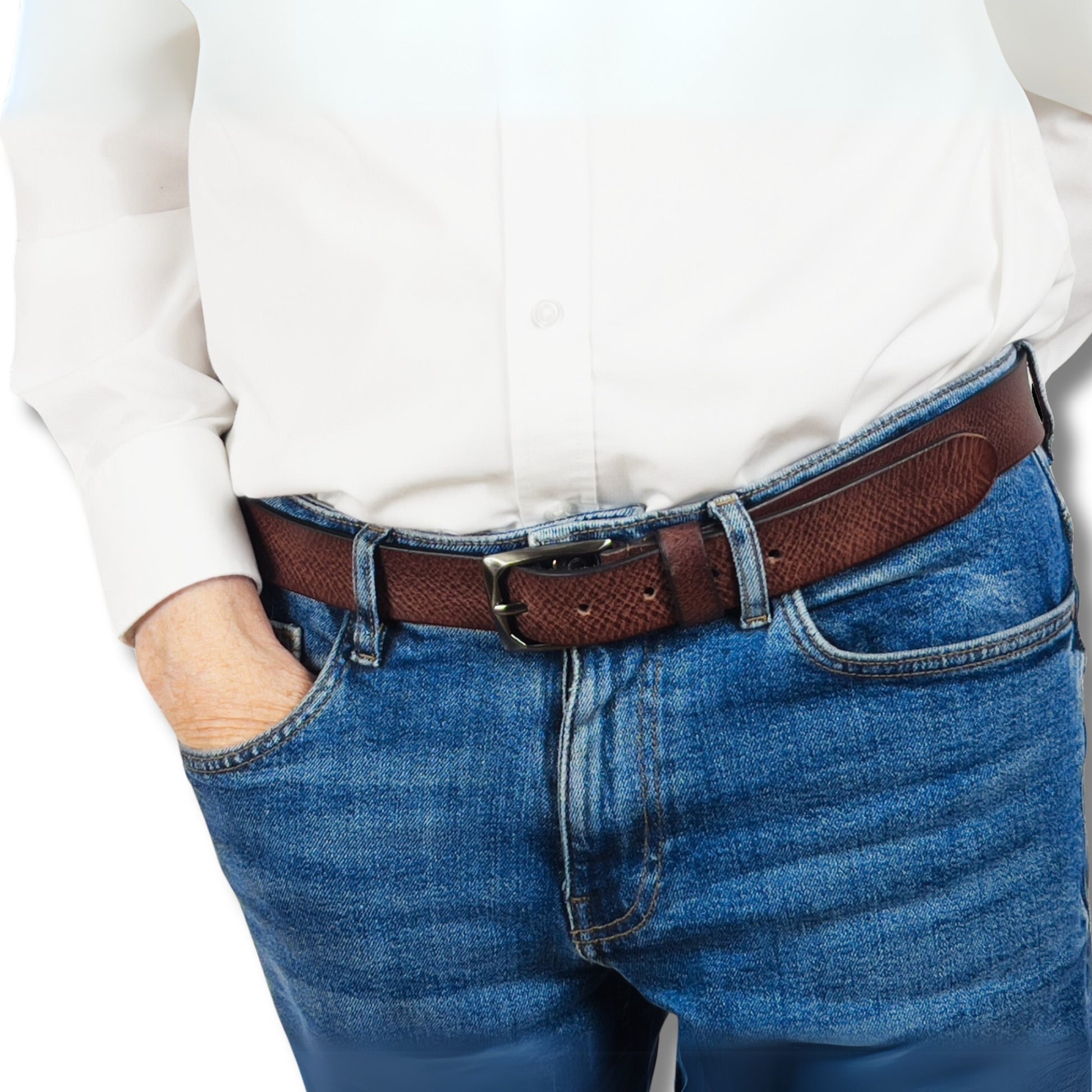 Brown leather belt threaded through denim jeans, highlighting buckle and smooth finish
