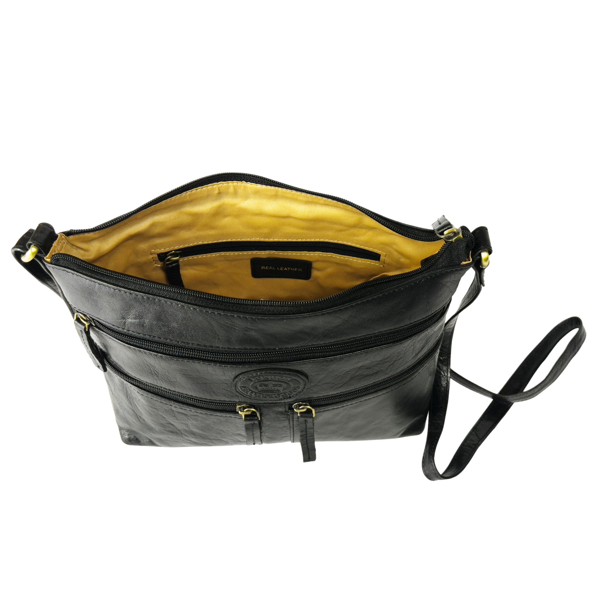 Interior view of a black leather crossbody bag with lining