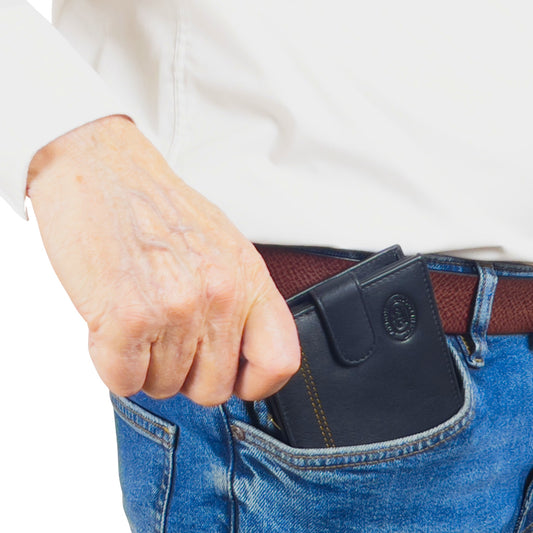 Black and tan leather wallet with slim design and RFID-blocking shown in a pocket