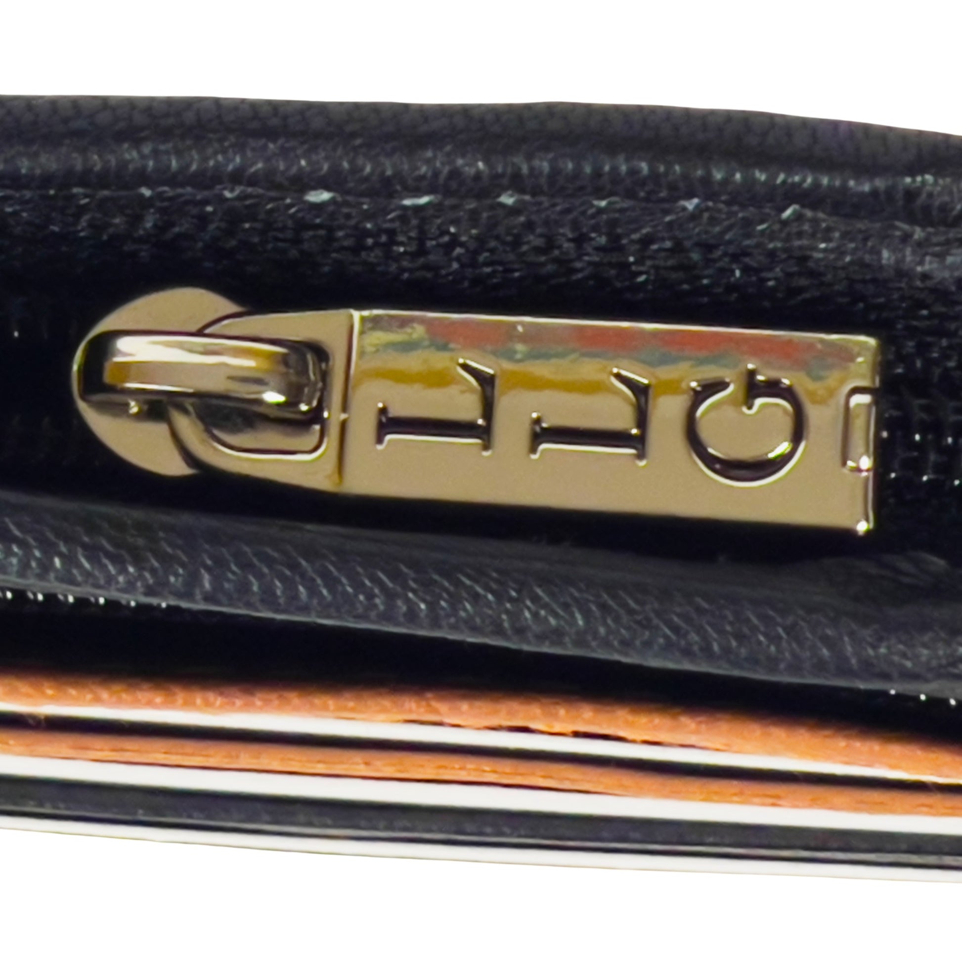 Close up of a slim-fit men's leather wallet with RFID protection, coin pouch, and card slots