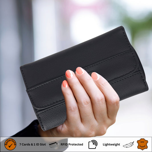 A black RFID leather trifold wallet held in hand, showcasing its compact size and sleek design