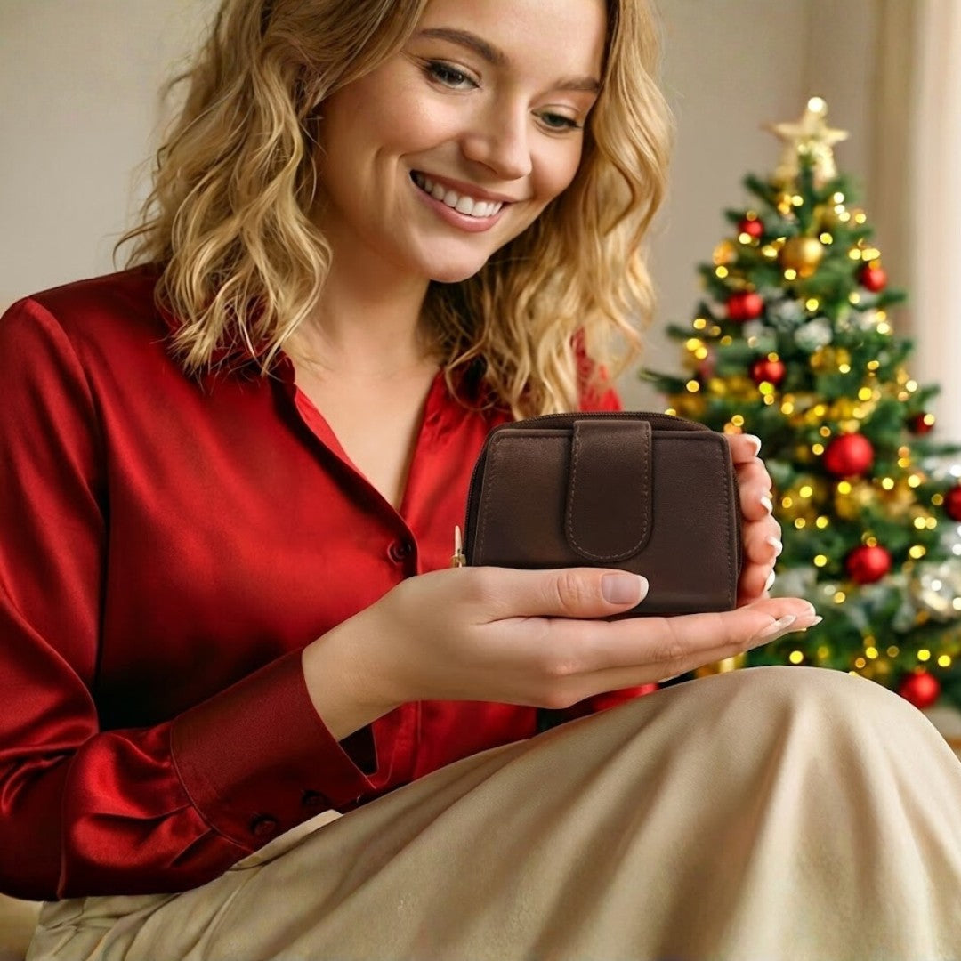 Woman opening a brown soft Nappa leather RFID purse, showing card slots and interior detail